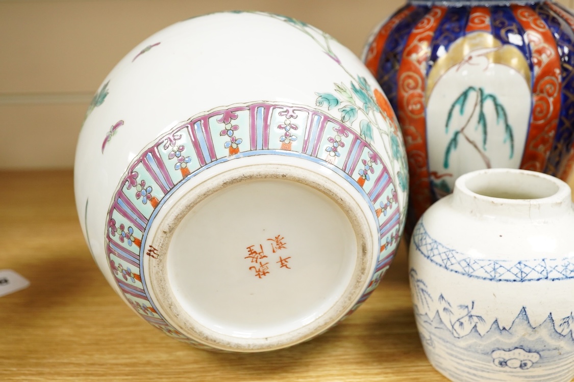 An Imari vase and cover-28cm high, a Chinese jar and prunus vase and a small blue and white jar.